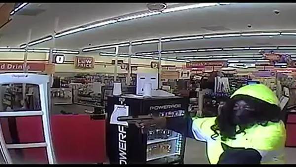 WATCH: Man wearing wig drags store manager, robs Family Dollar at gunpoint, police say