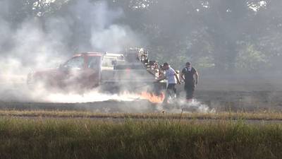 PHOTOS: Grass fire temporarily stops traffic on Highway 51