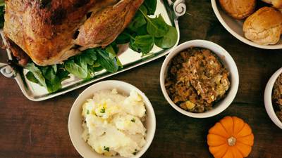 Is it cheaper to cook Thanksgiving dinner or eat out?