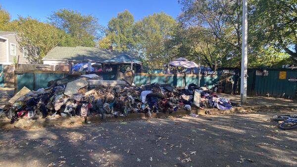 Grahamwood neighbors tired of massive trash pile, homeless camp