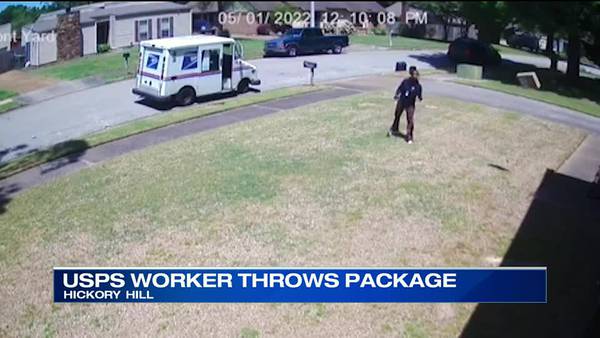 Video shows postal worker toss package across lawn